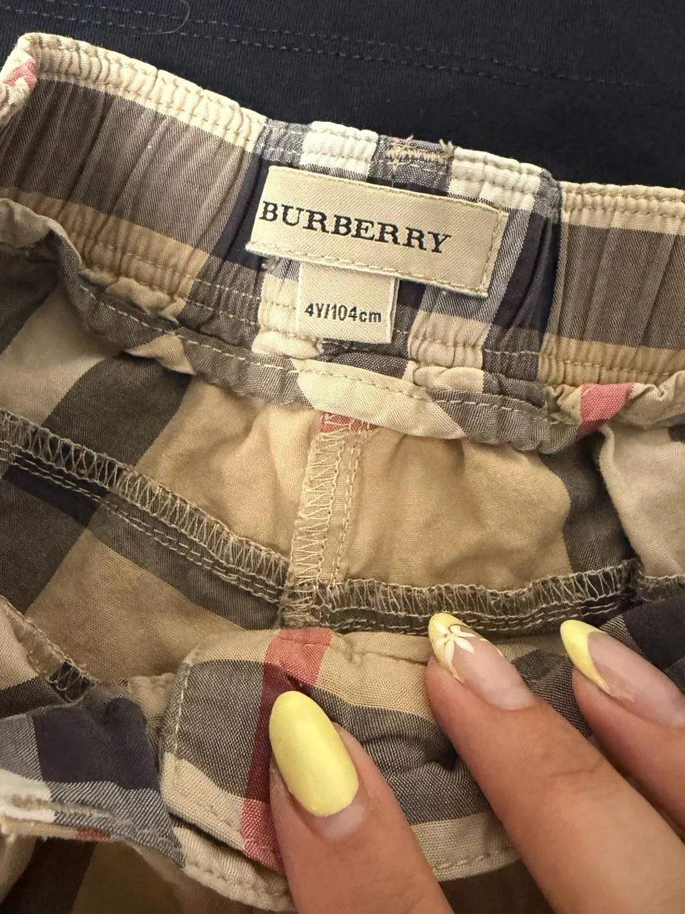 Burberry Black Top with Tan Plaid Shorts